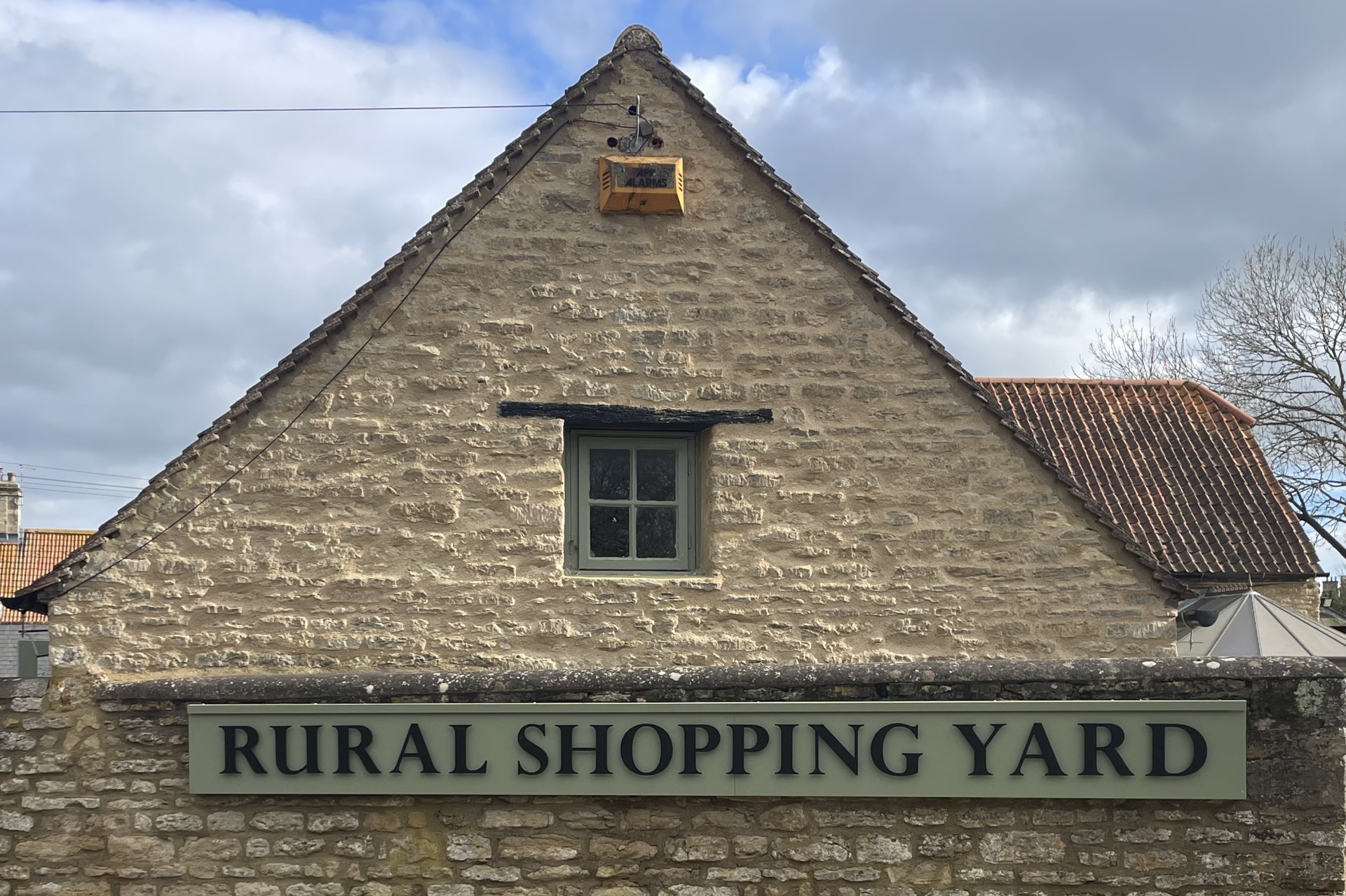 Rural Shopping Yard sign at Castle Ashby, Northamptonshire.